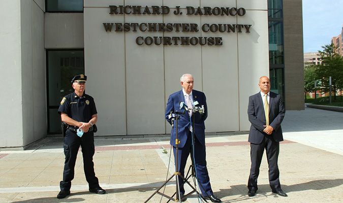 DA Scarpino holding press conference